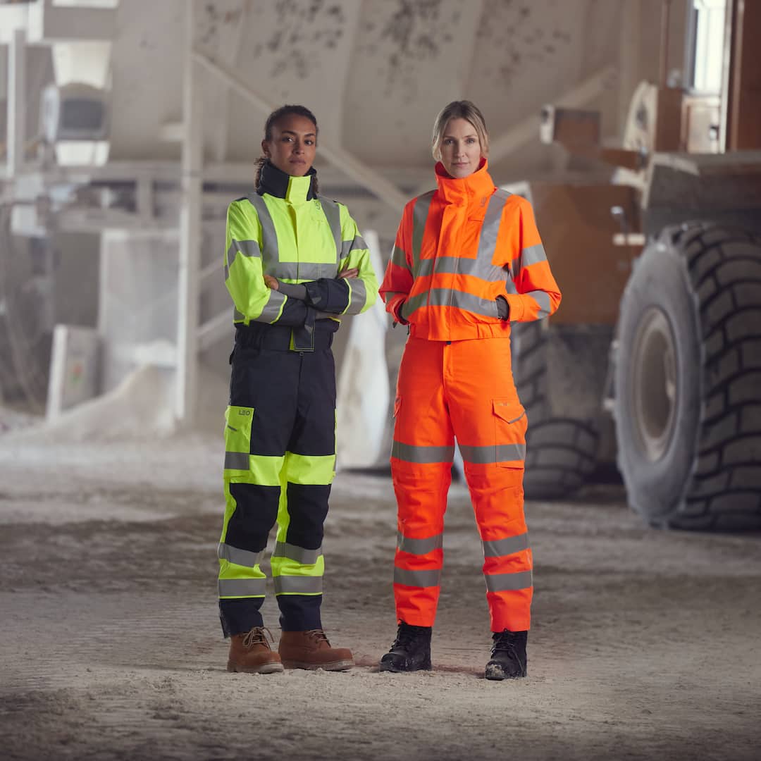 Two women dressed in fitted workwear and boots.jpg (75 KB)